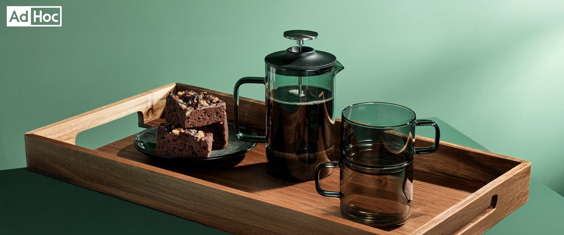 French press and mugs on wooden tray
