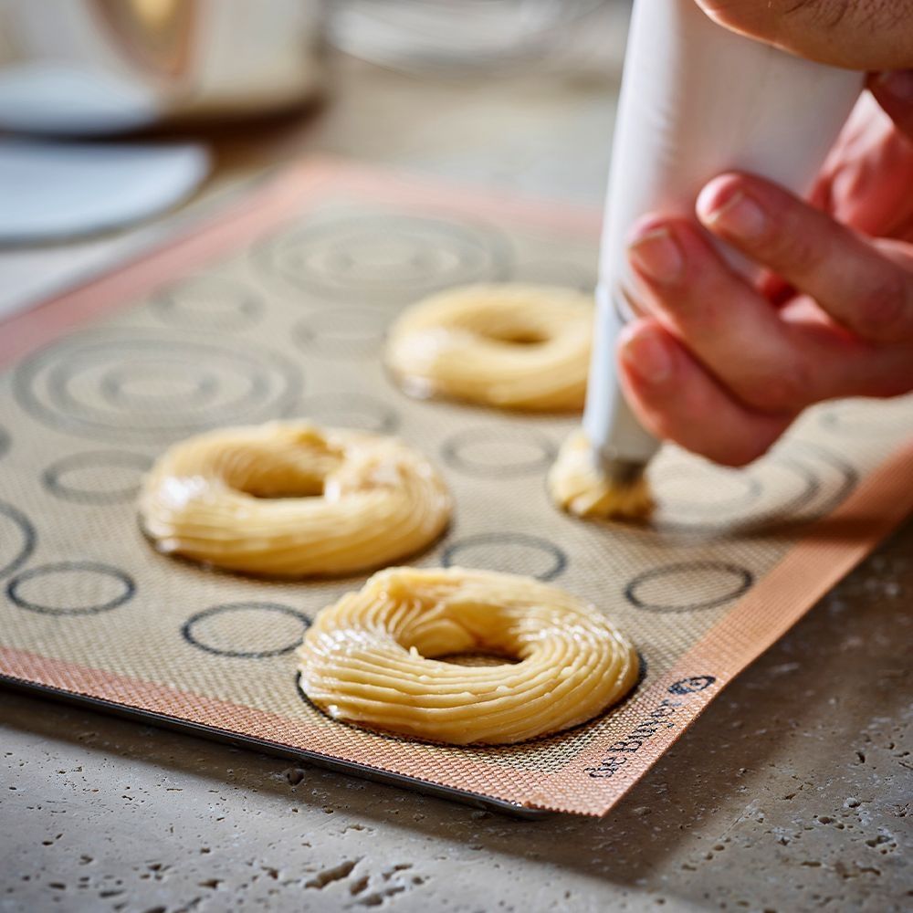 Dough rings on silicone baking mat with markings
