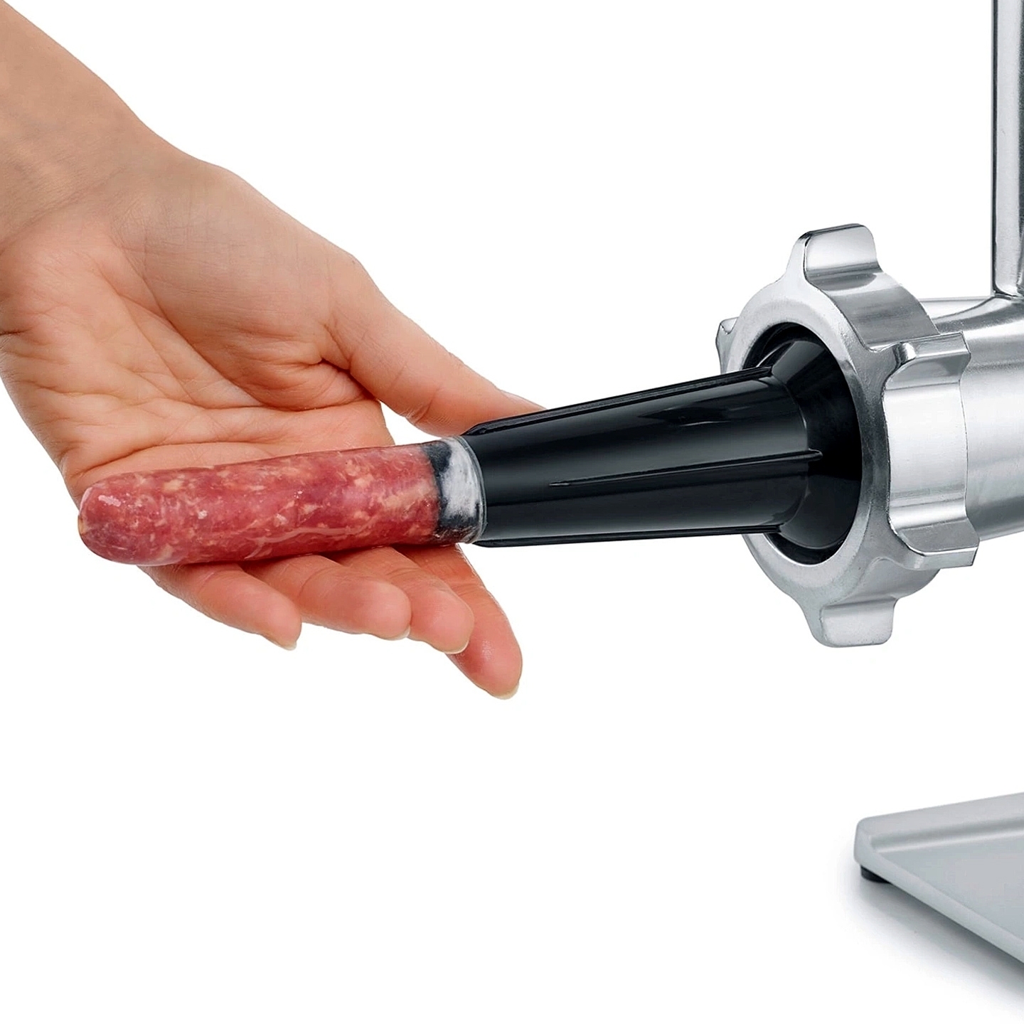 Hand filling sausage casing with stuffer