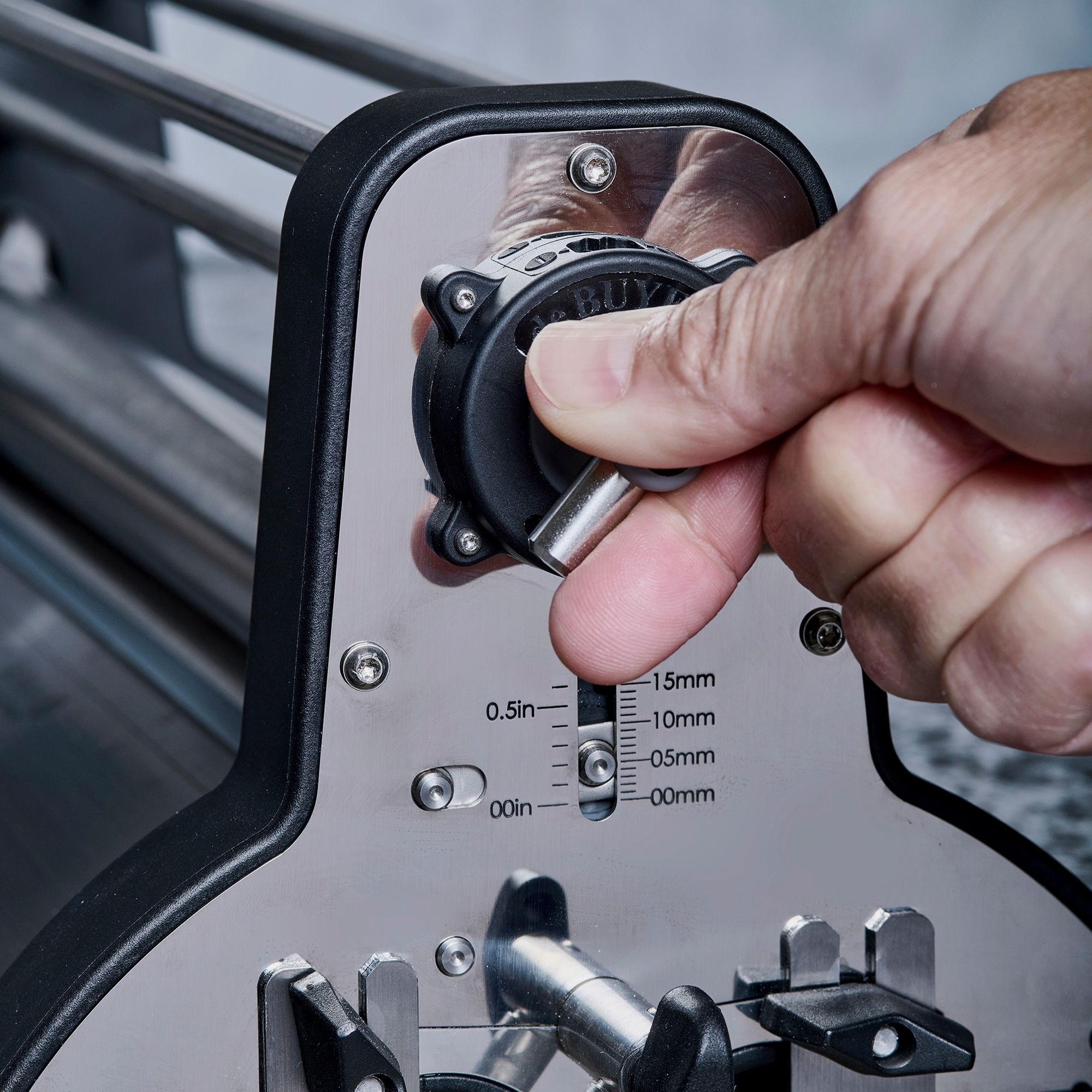 Hand precisely sets cutting thickness on cutter