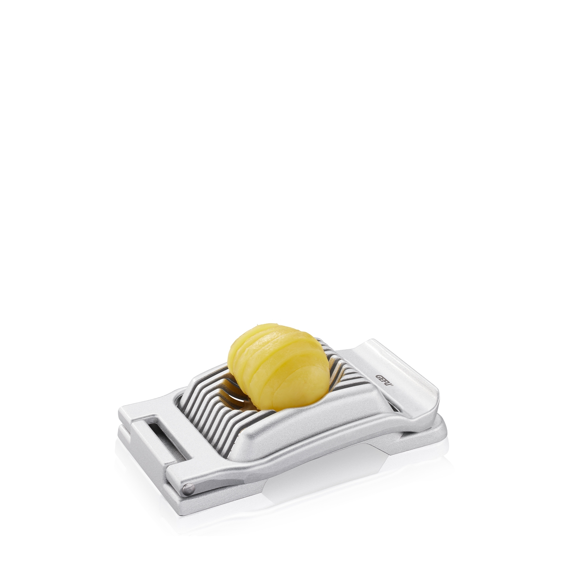 Silver egg slicer with sliced egg