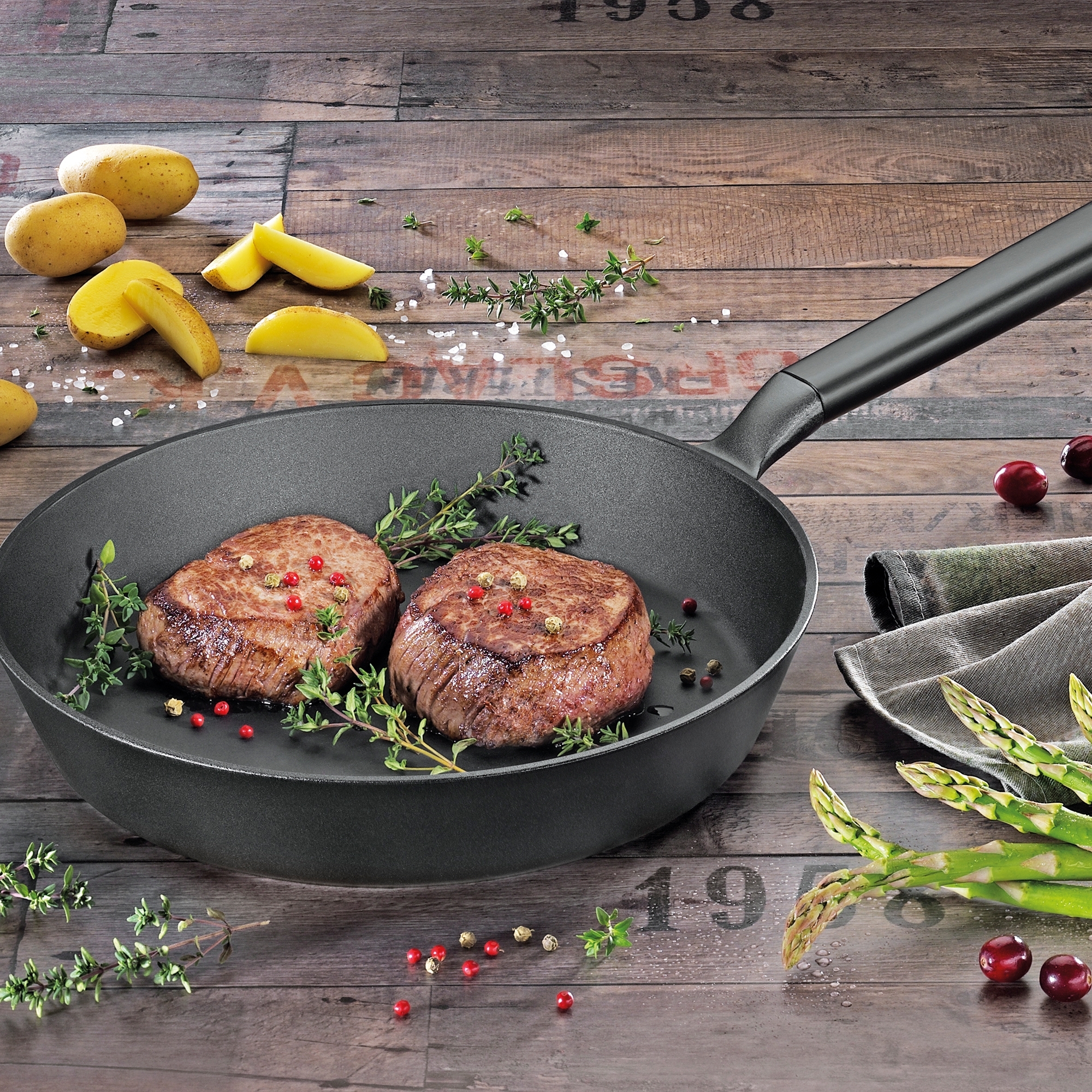 Round black frying pan with handle