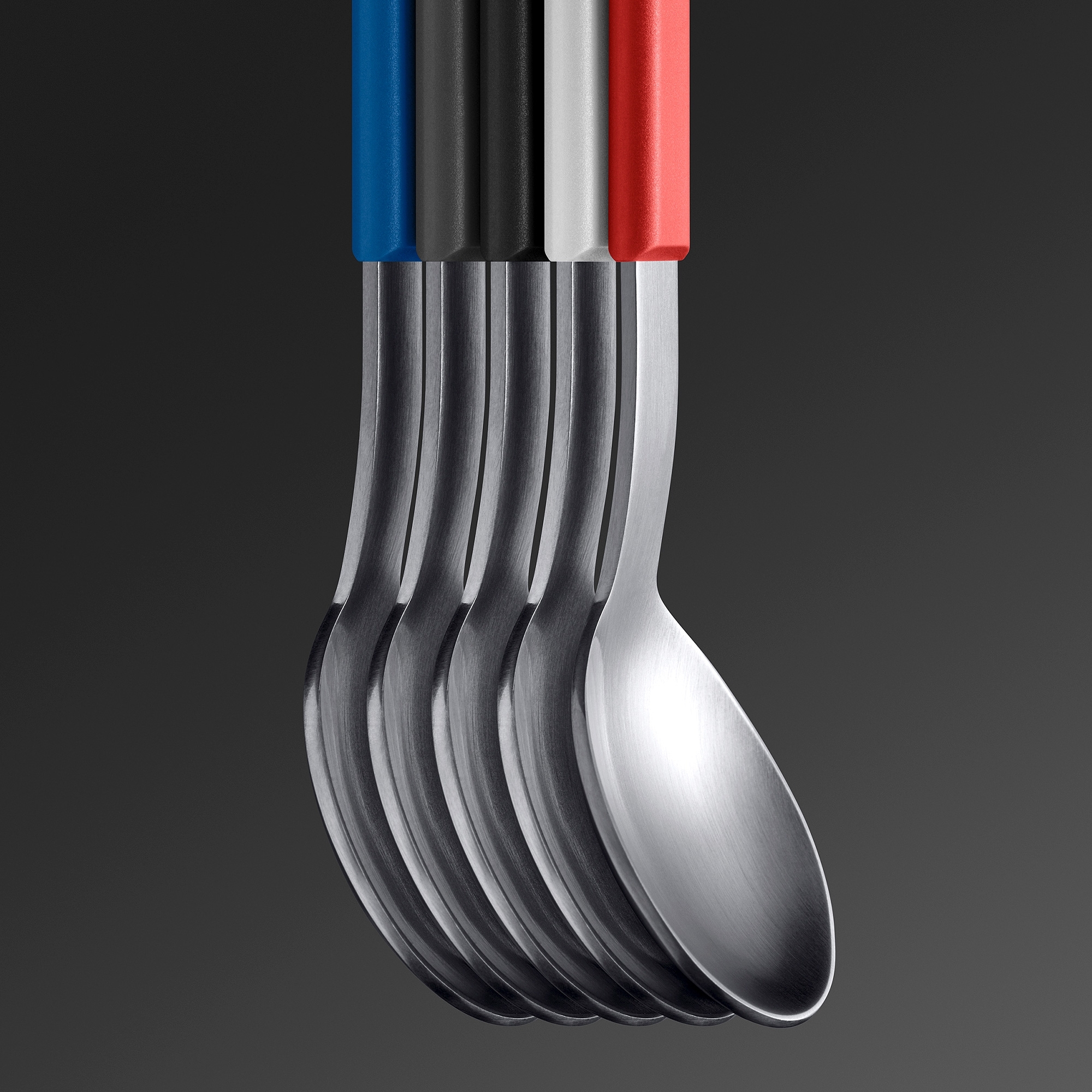 Fünf Edelstahl-Löffel mit farbigen Griffen