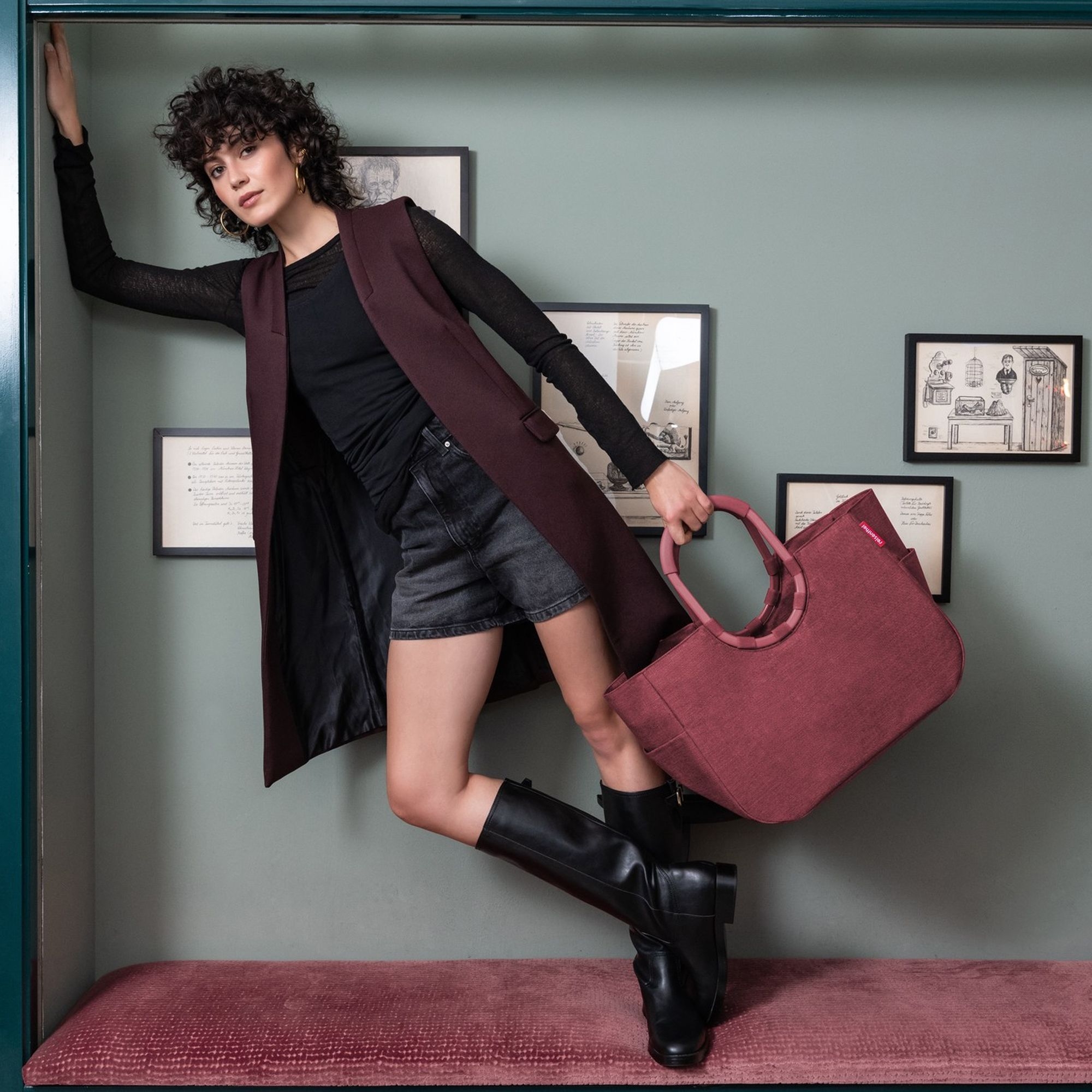 Woman with burgundy shopper bag and boots