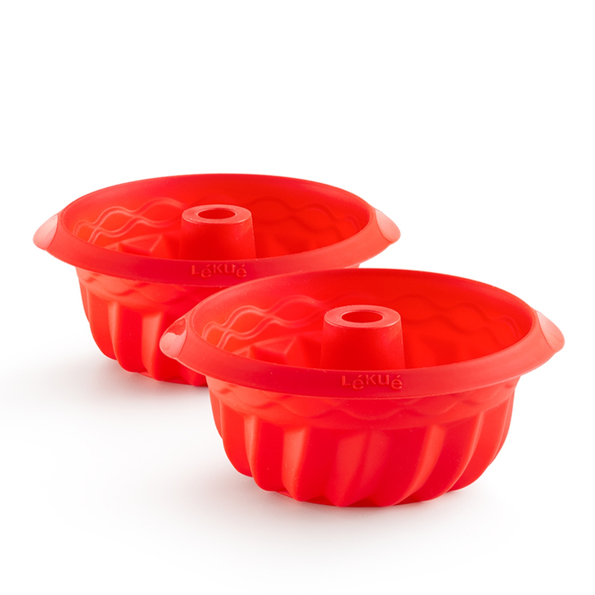 Two red silicone bundt cake moulds by Lékué