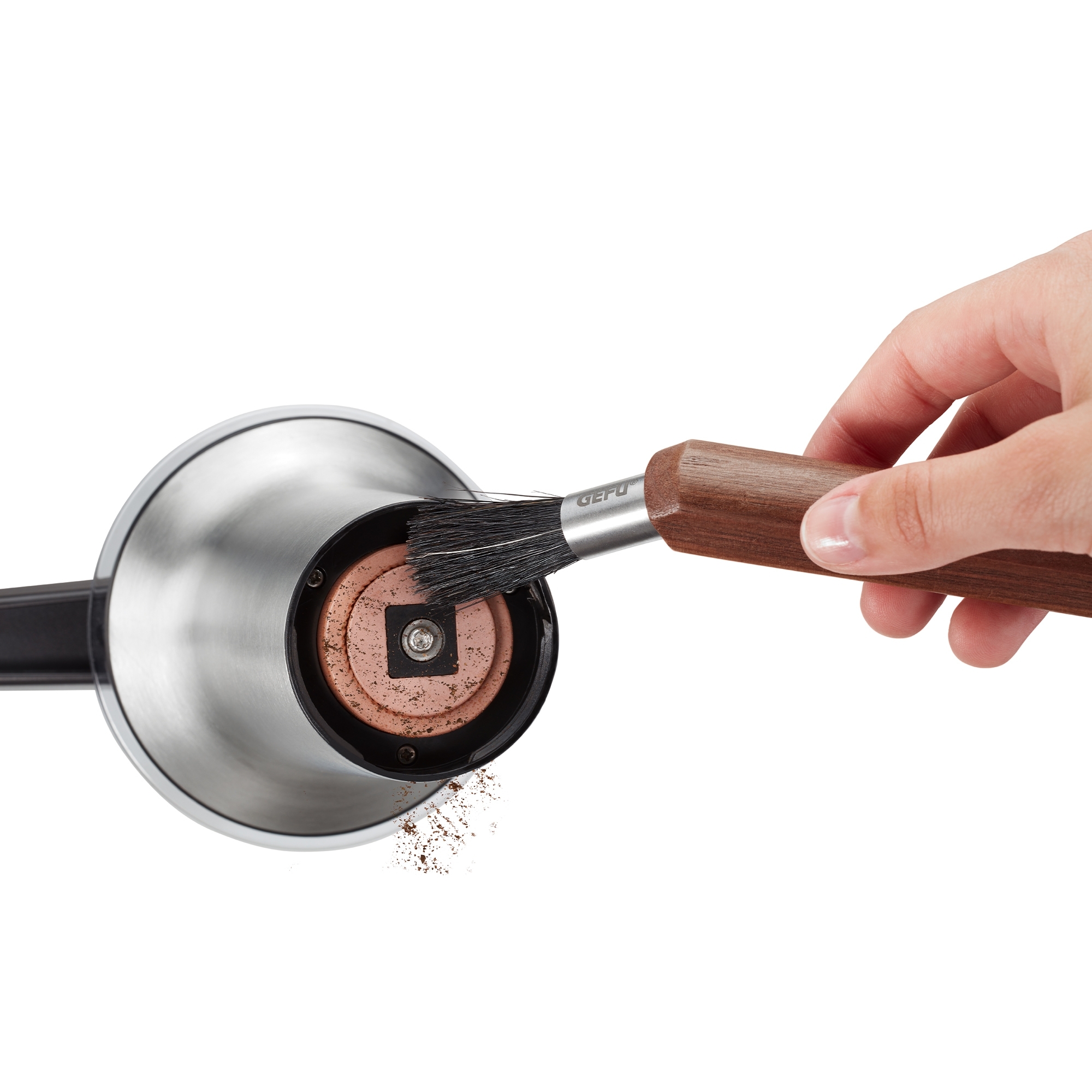 Cleaning coffee grinder with brush and grinding plate