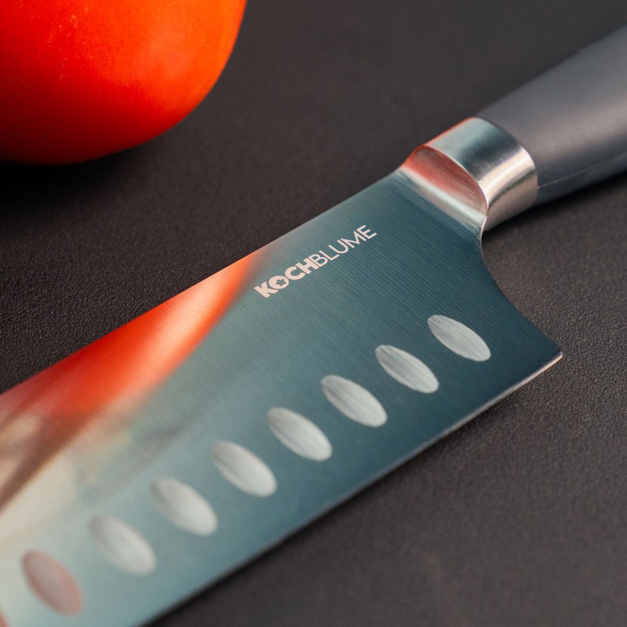KOCHBLUME chef’s knife with granton edge by tomato
