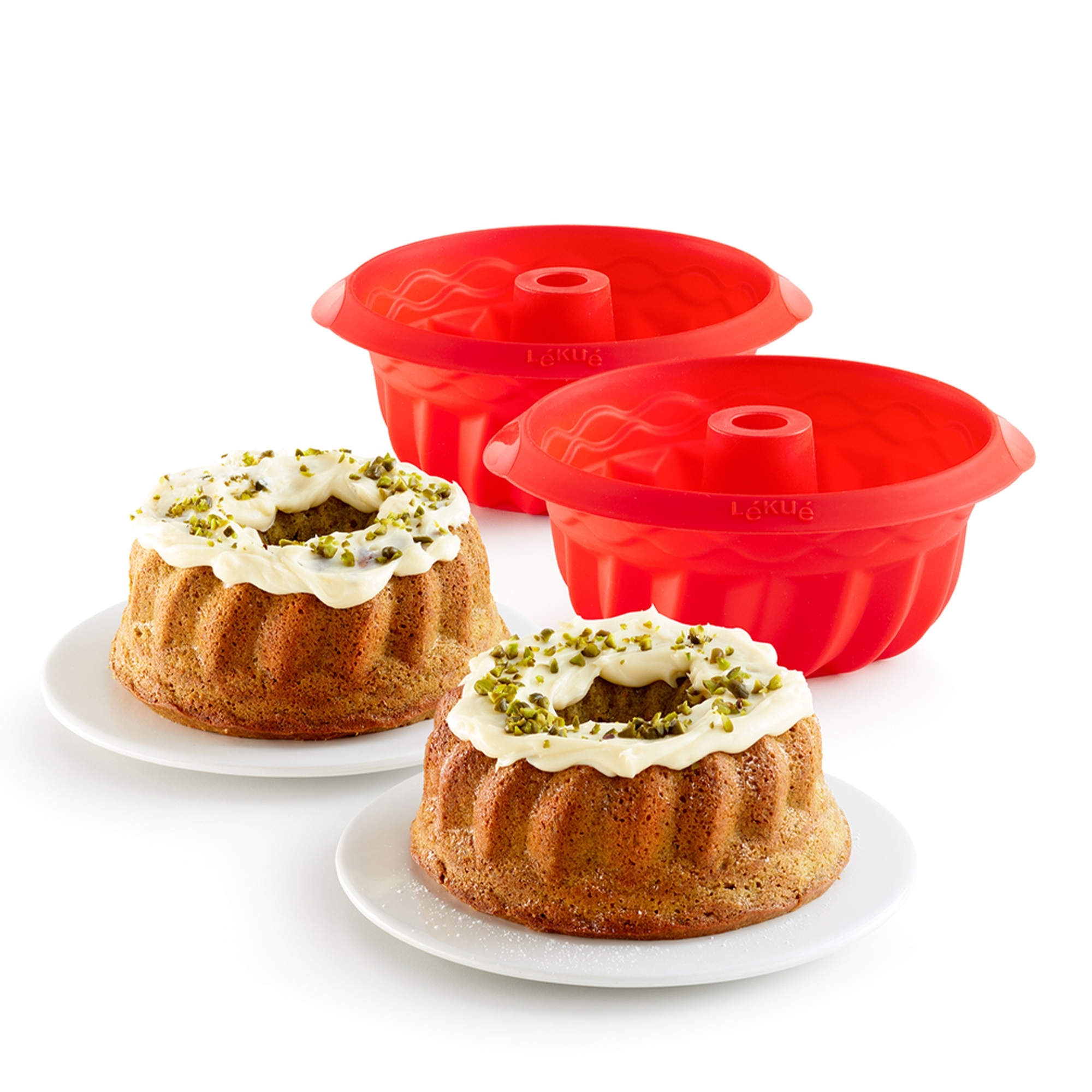 Red silicone Bundt cake moulds with decorated cakes
