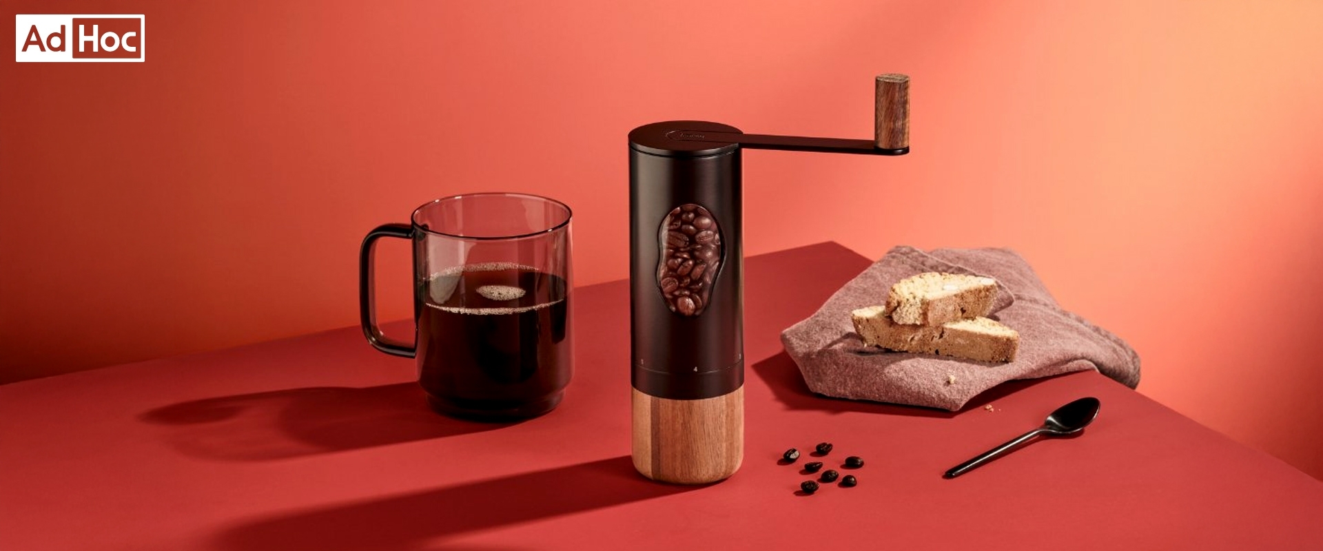 AdHoc manual coffee grinder with coffee and biscuits