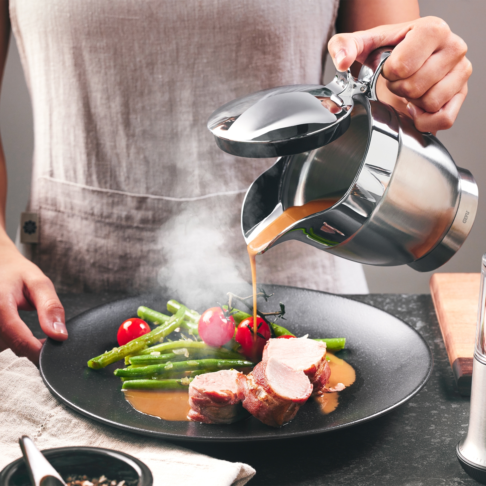 Hot gravy from stainless steel sauce jug