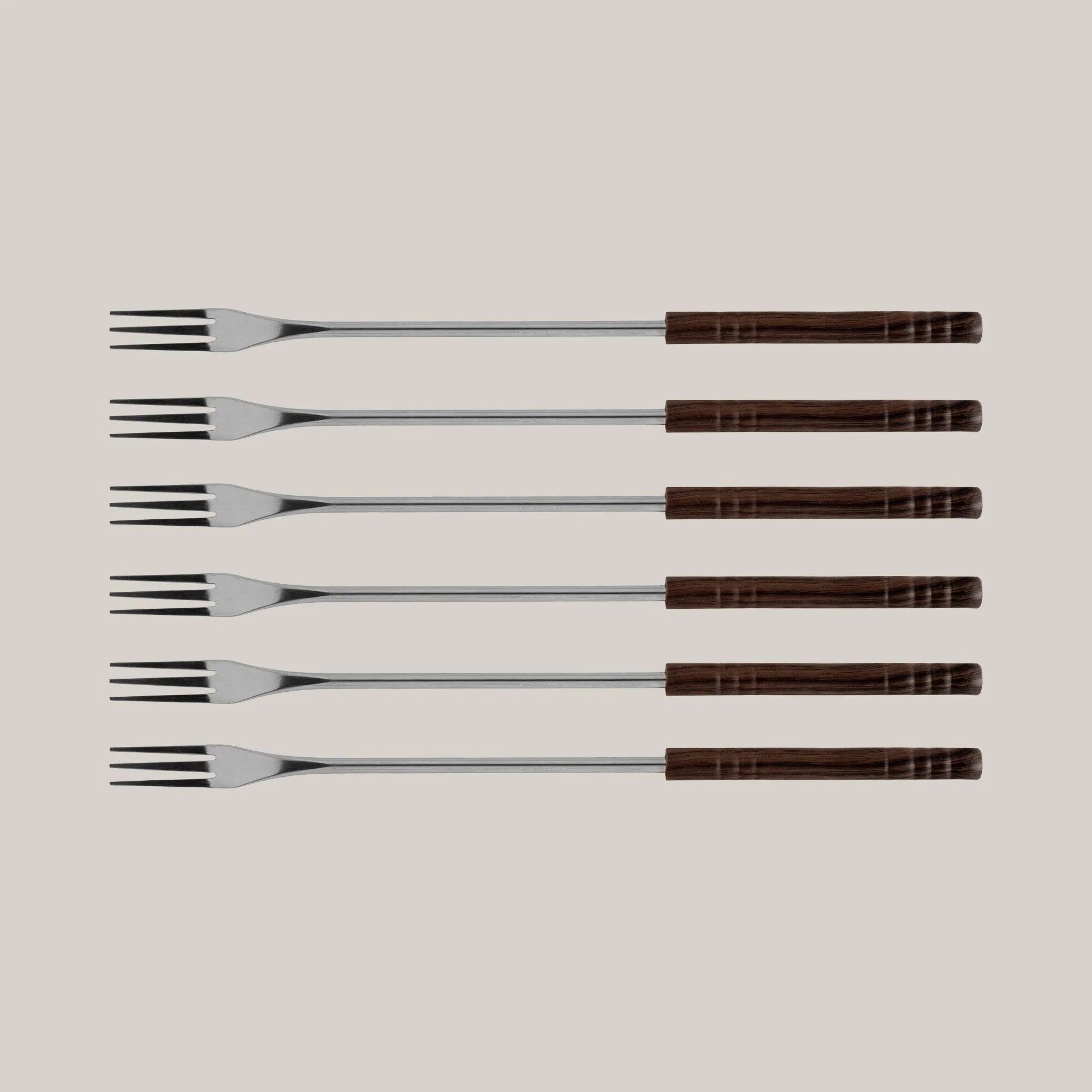 Six long stainless-steel fondue forks with wooden handles