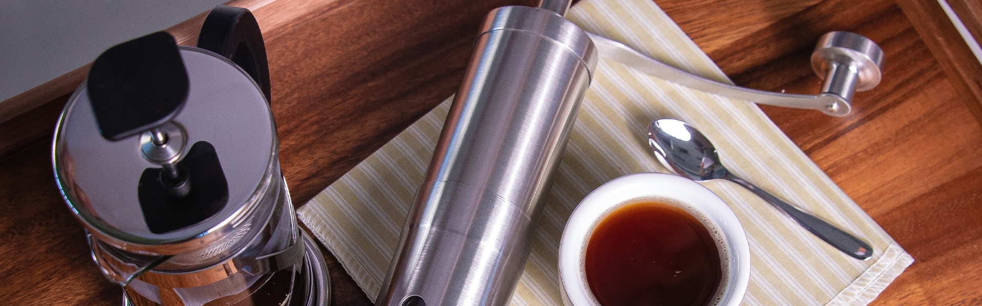 Manual stainless steel coffee grinder with fresh coffee