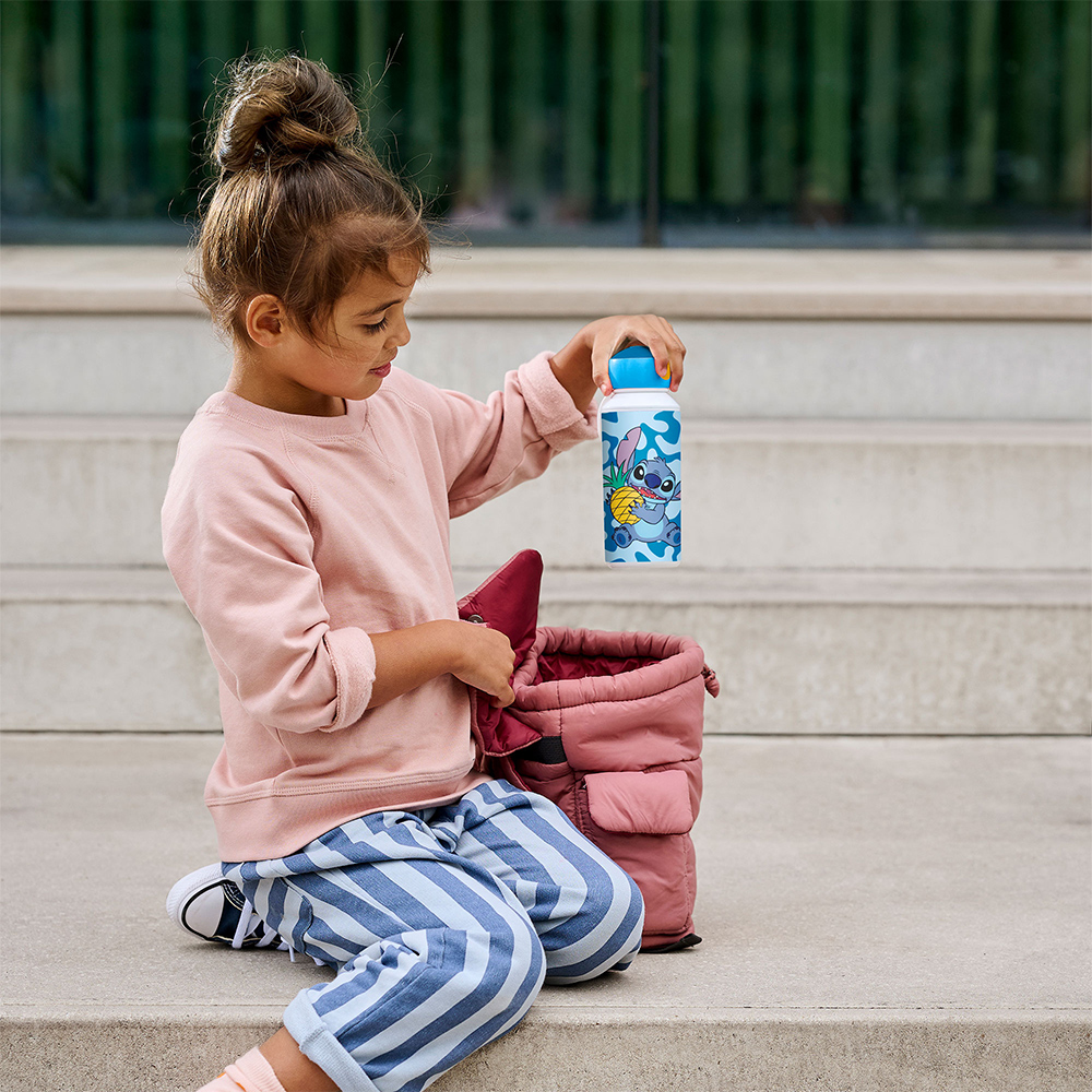 Child holding colourful kids water bottle