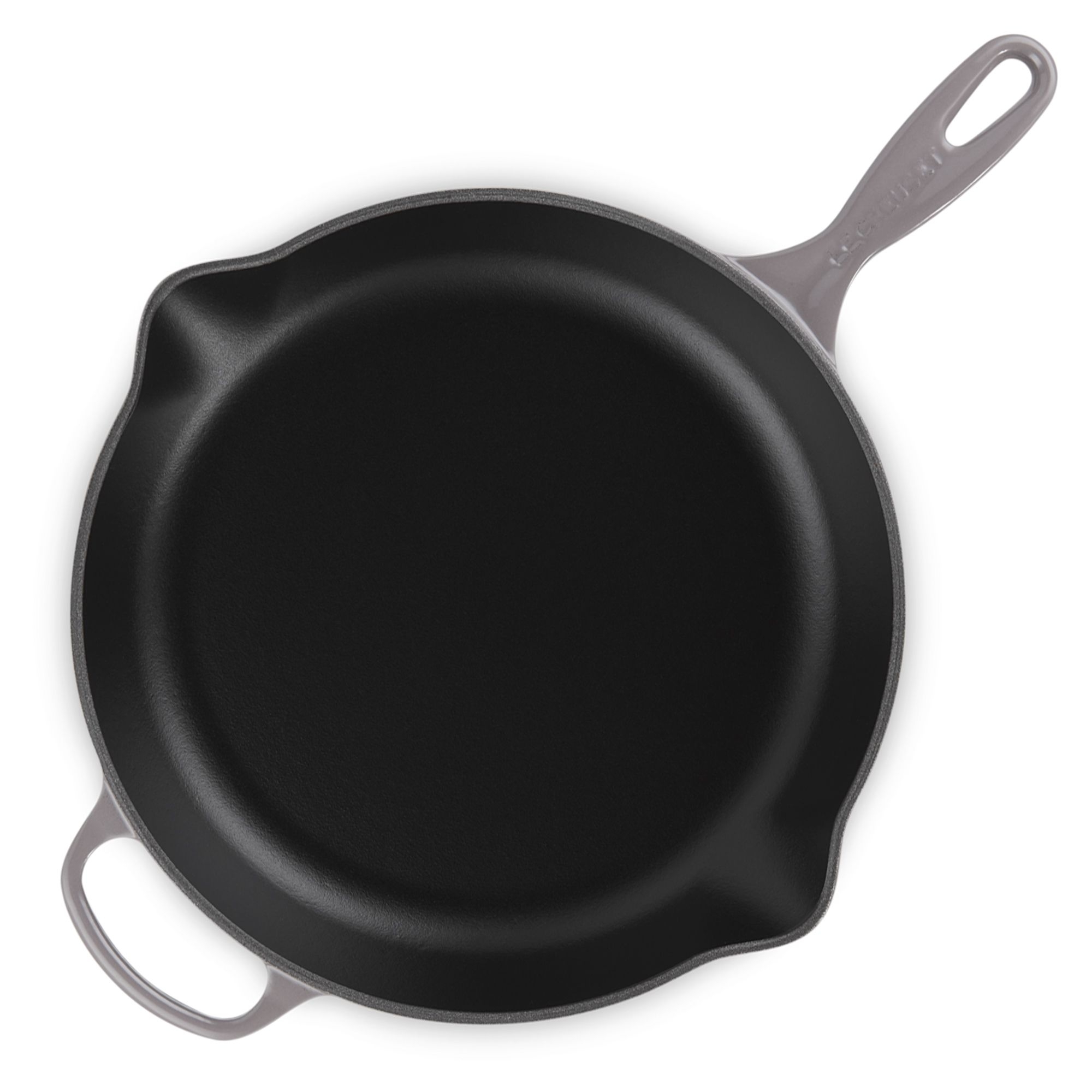 Black cast iron frying pan with long handle