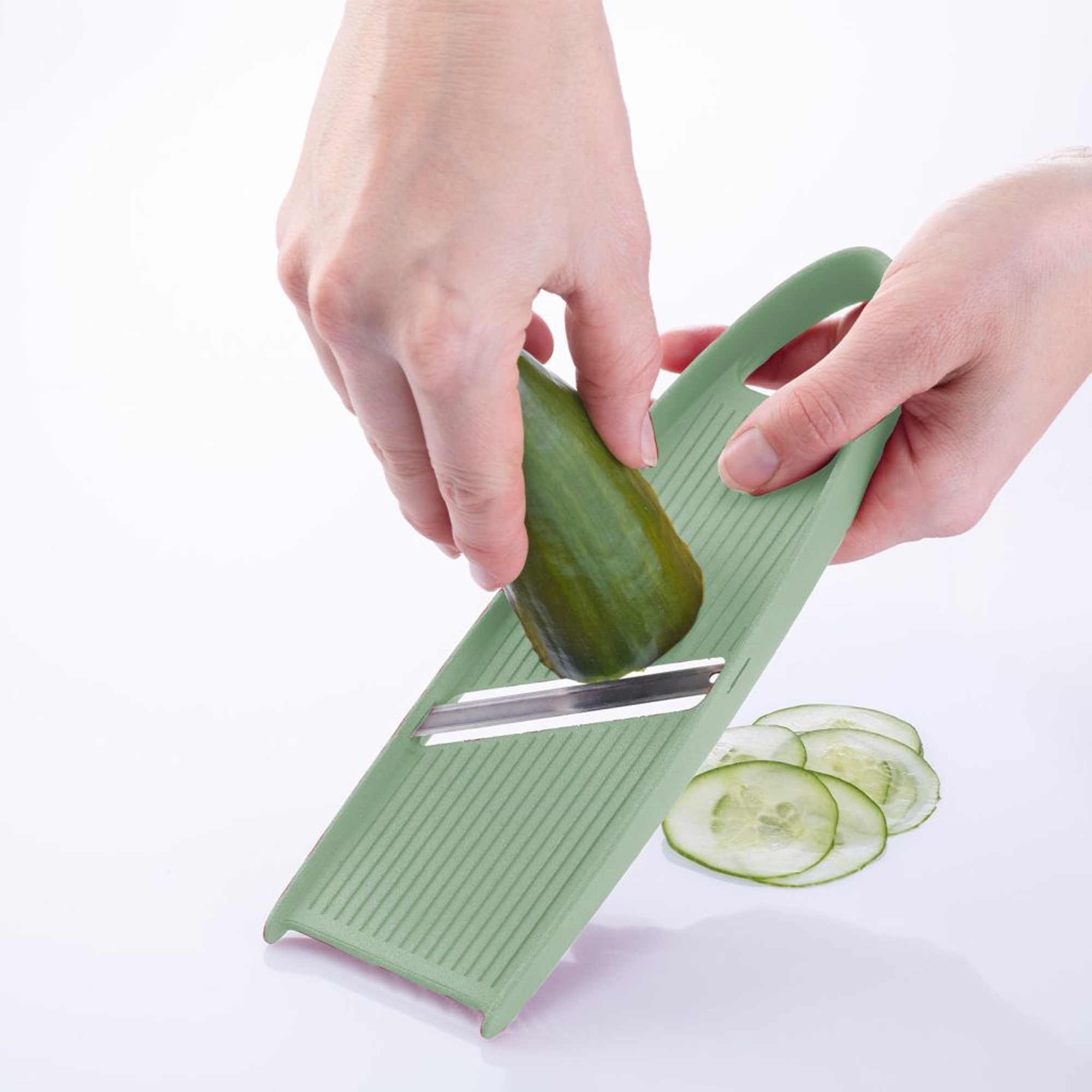 Westmark Hobelix mint green slicing cucumber into thin slice