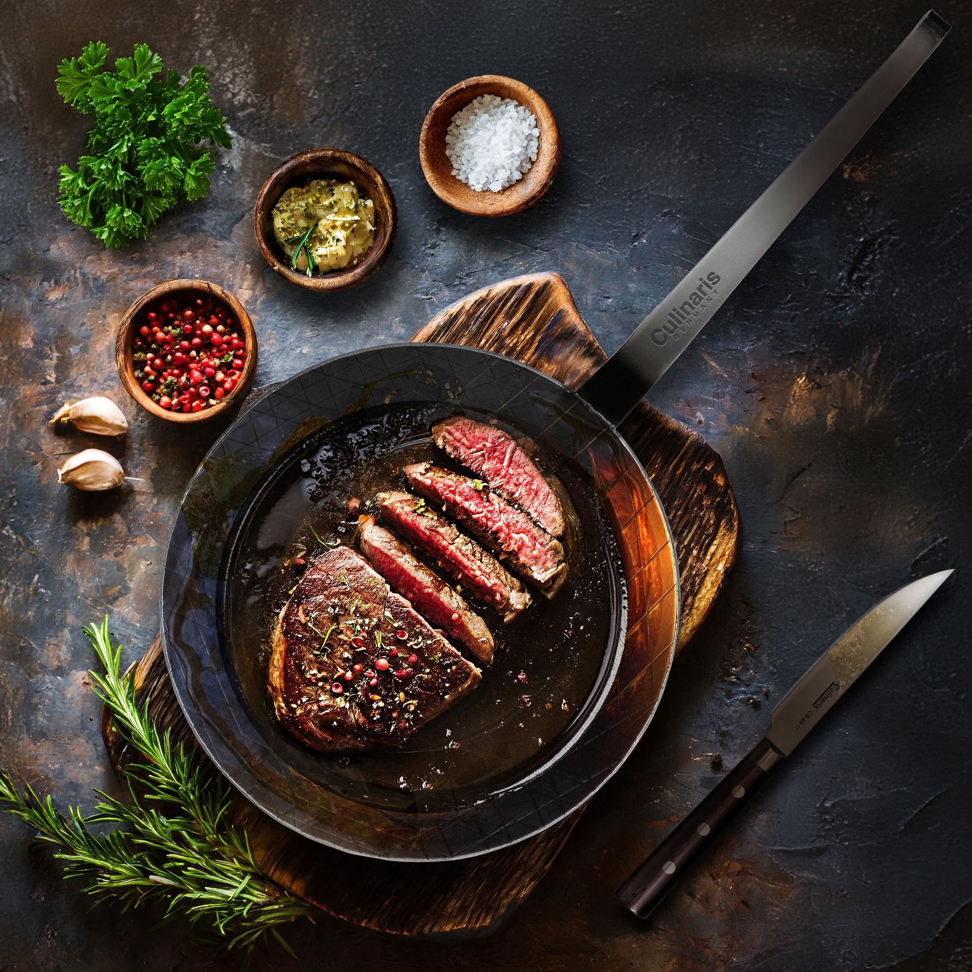 Medium cooked steak in pan with spices and herbs