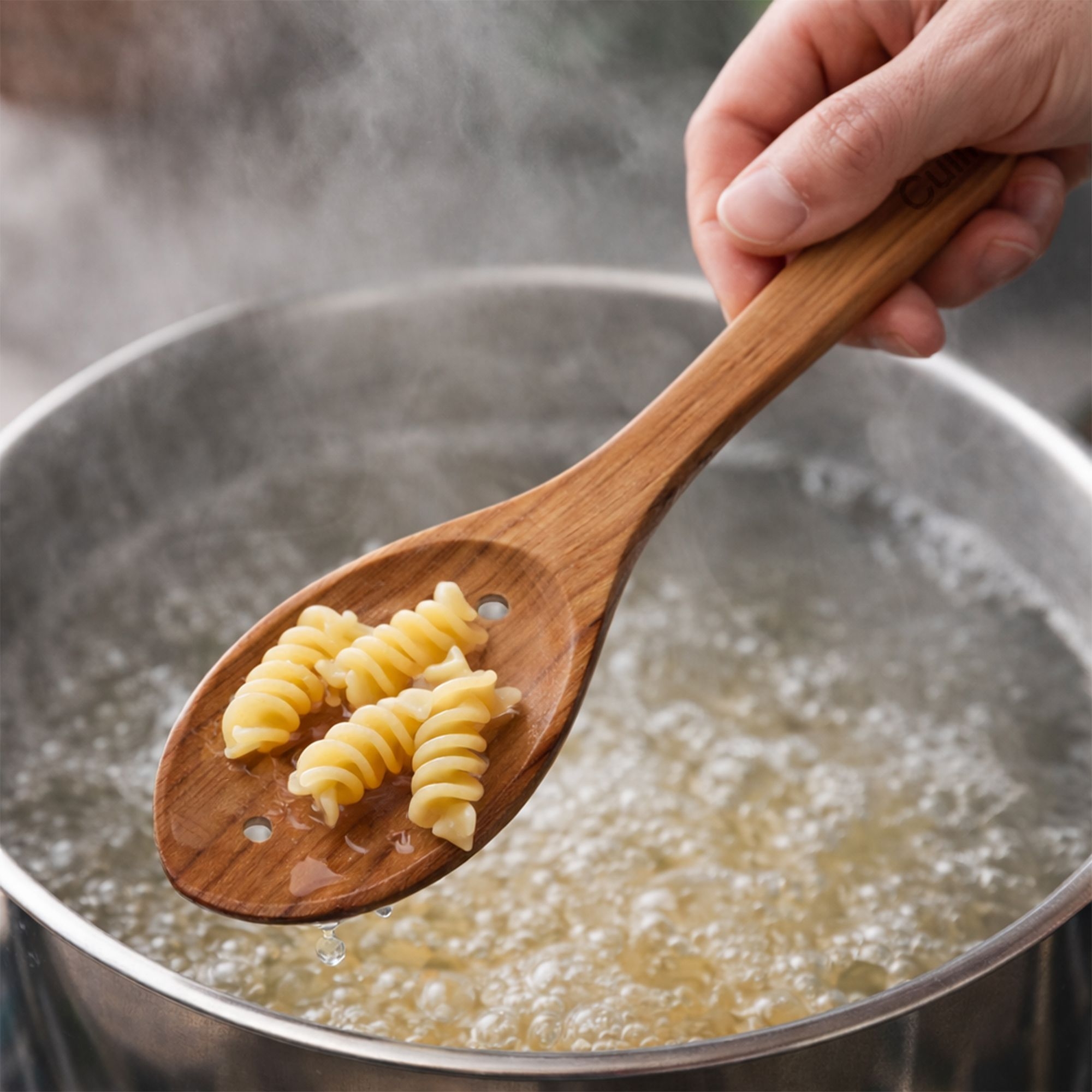 Oval cherry wood spoon with holes by Culinaris