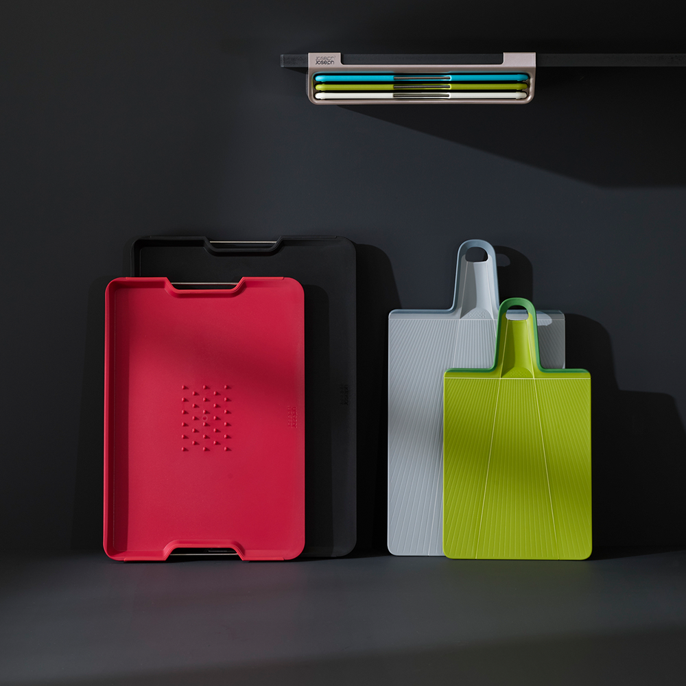 Foldable Chop2Pot Plus small cutting board in black