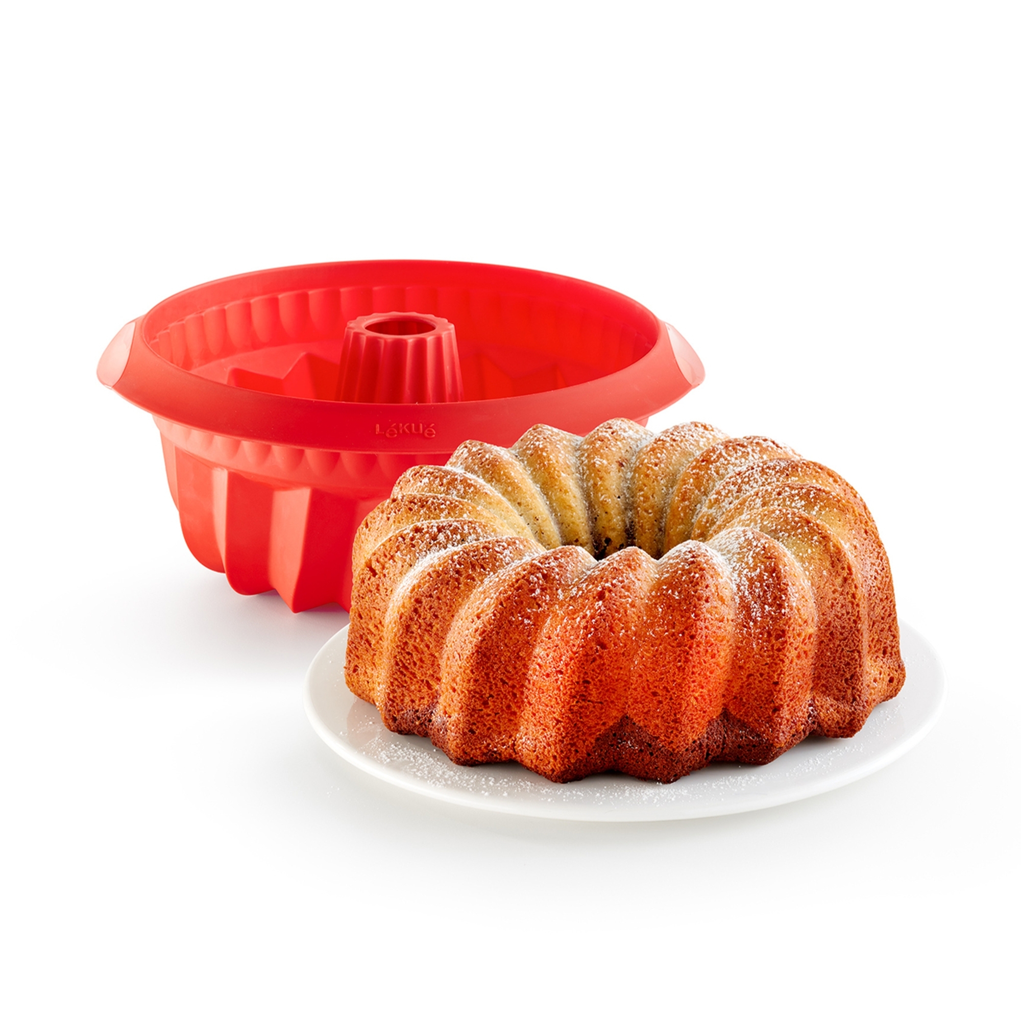 Red silicone bundt cake mould with bundt cake