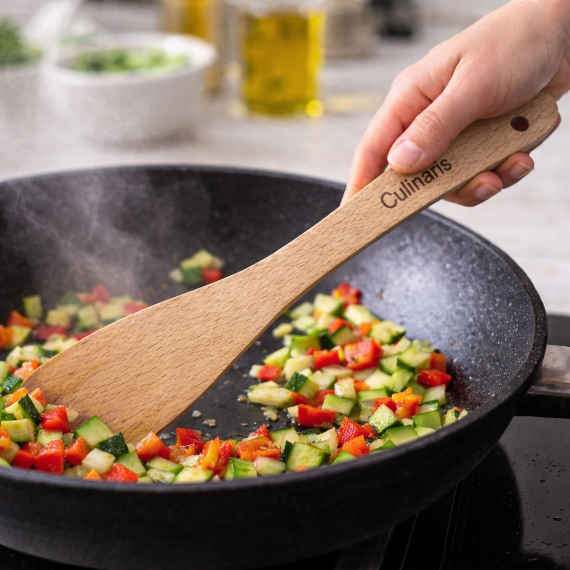 Curved beechwood spatula by Culinaris in use