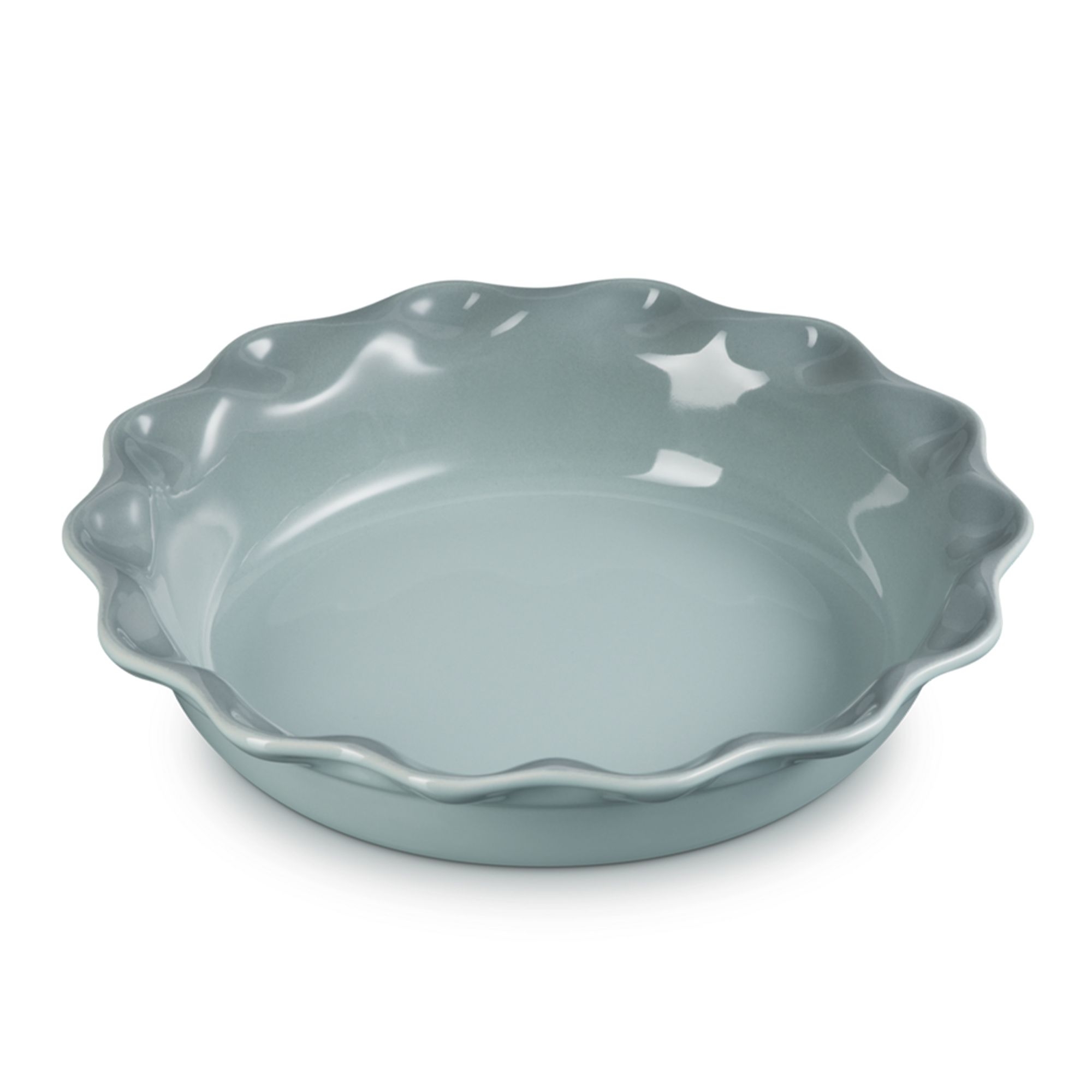 Round mint green ceramic dish with wavy rim