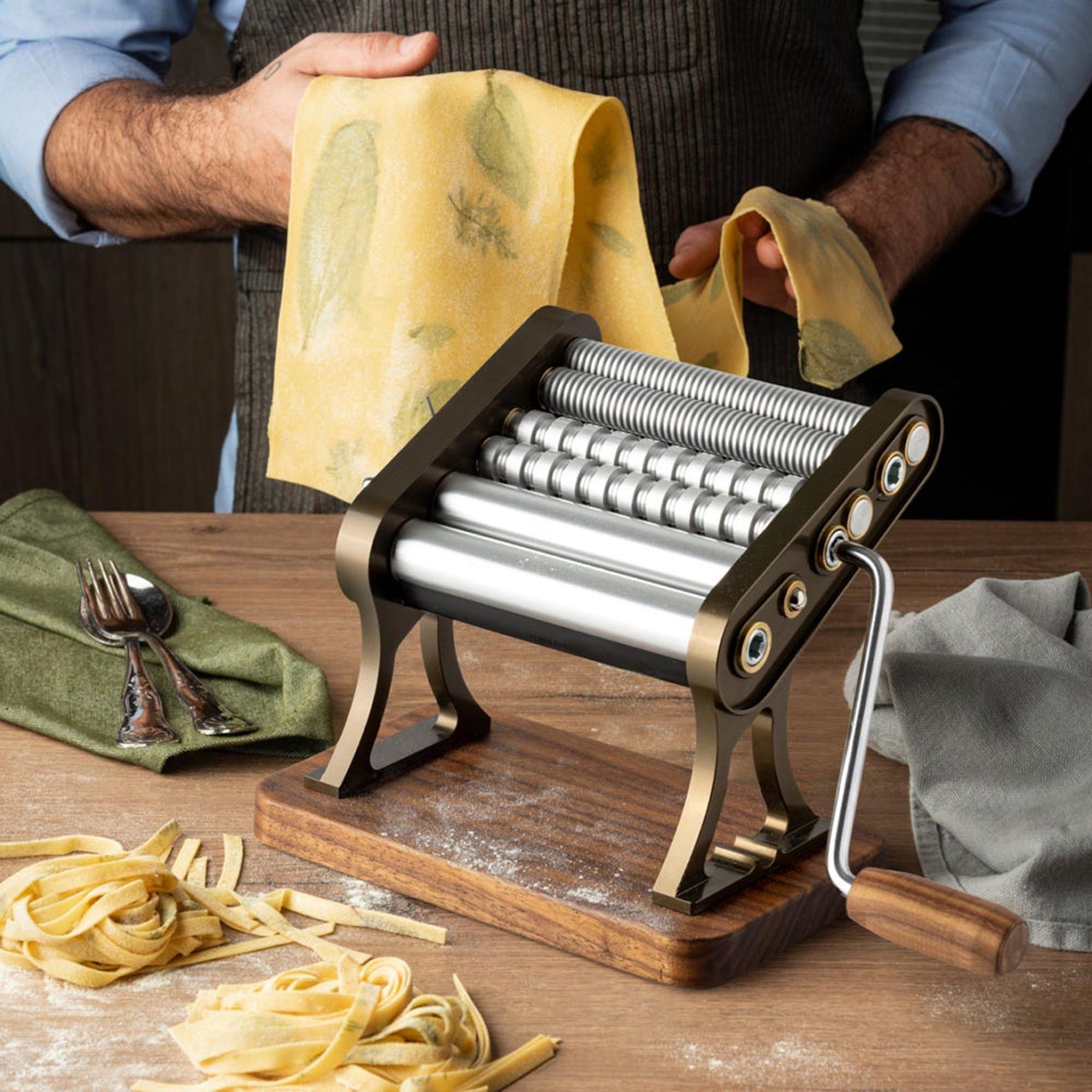Manual metal pasta maker with wooden handle