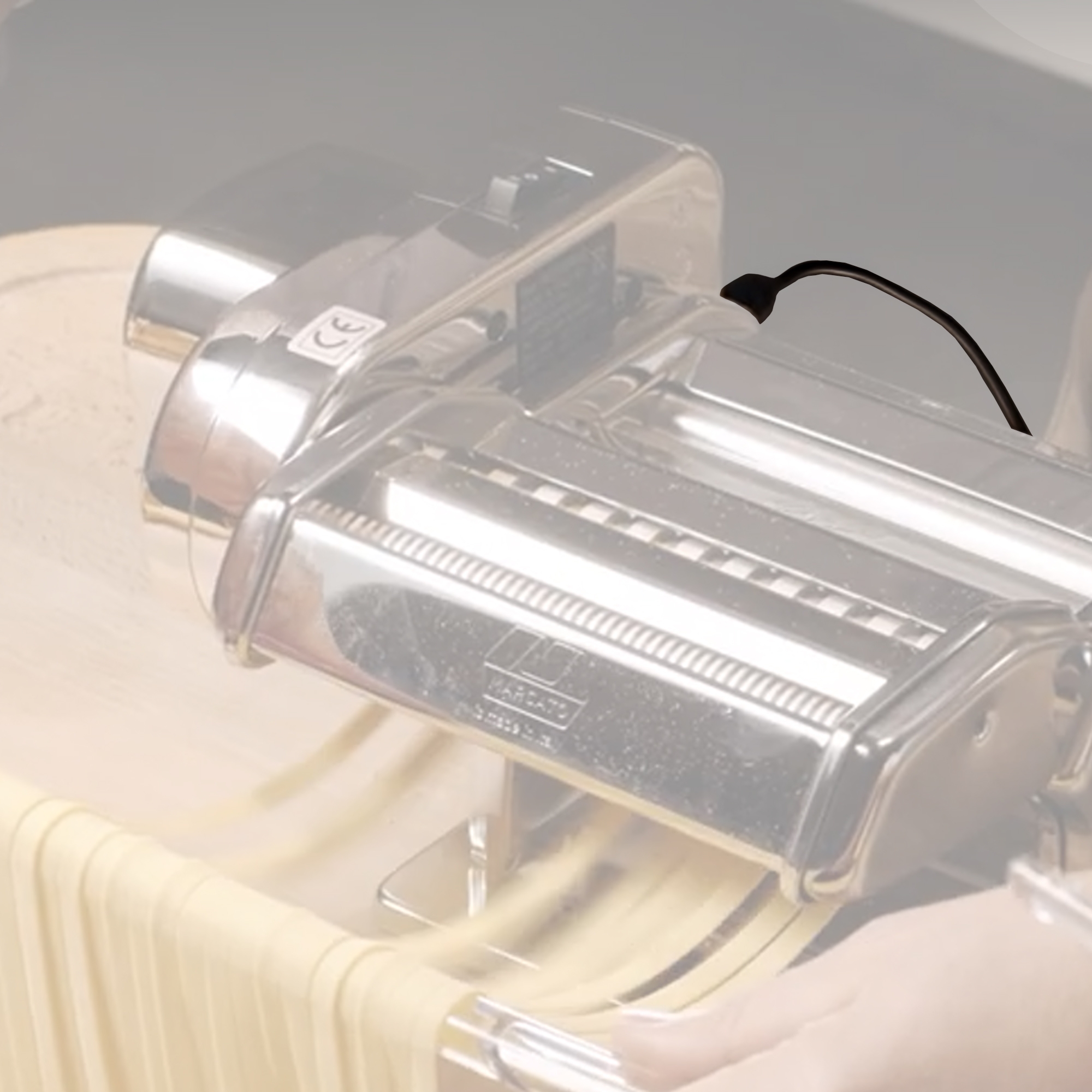 Electric pasta machine rolling fresh dough