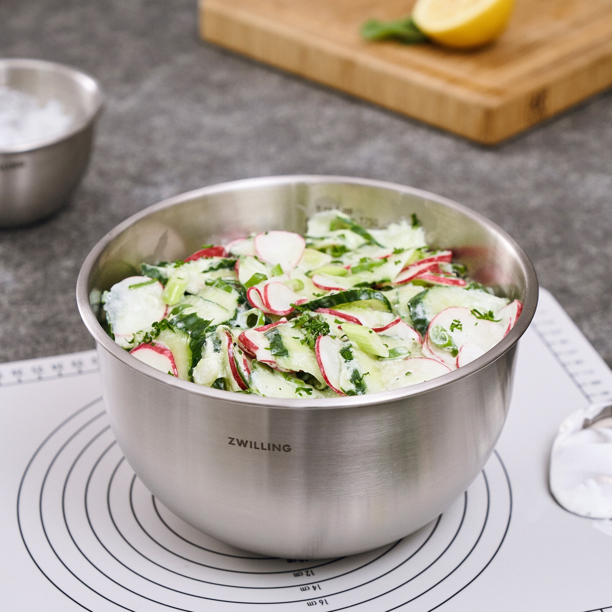 Fresh cucumber radish salad in ZWILLING stainless steel bowl