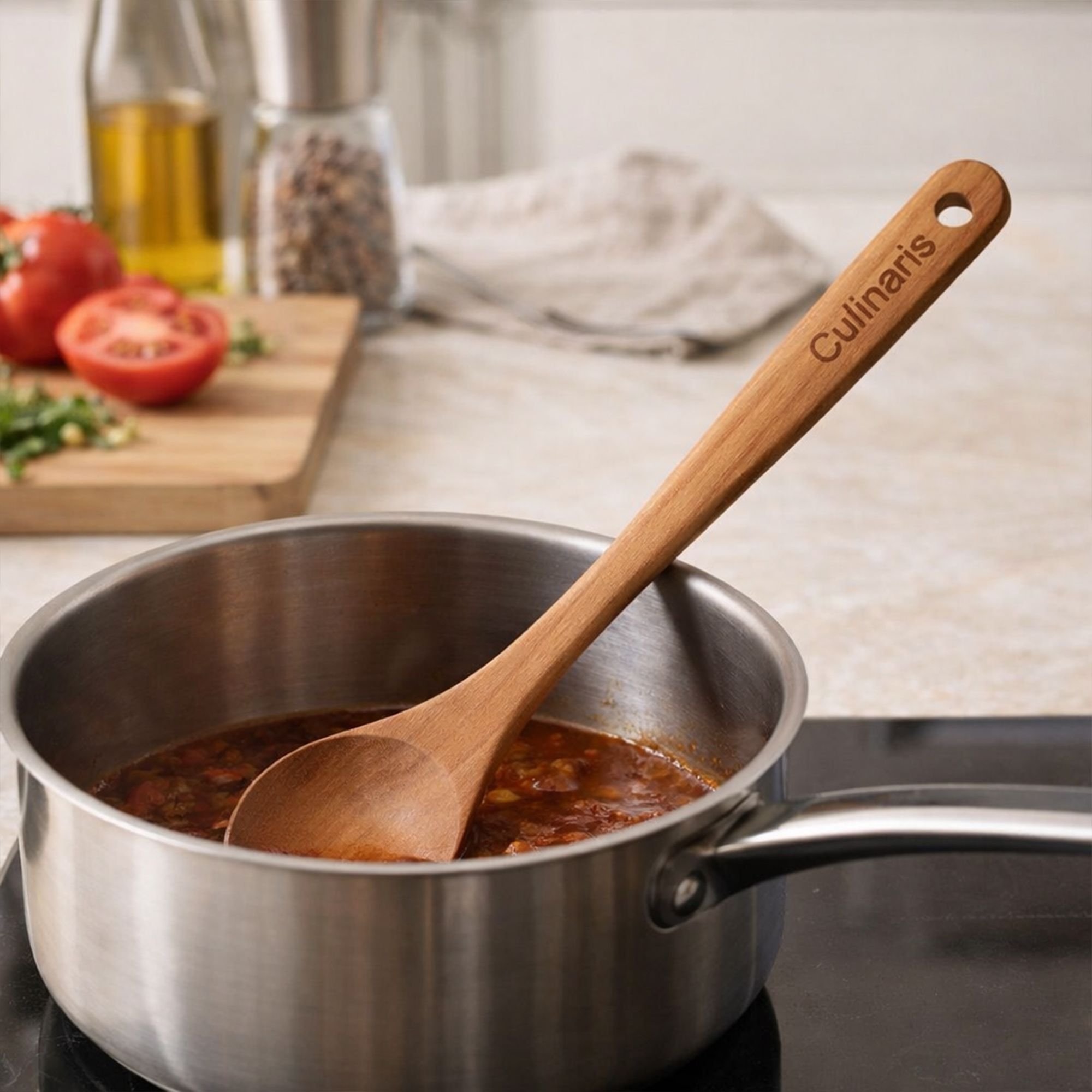 Culinaris cherry wood cooking spoon in saucepan