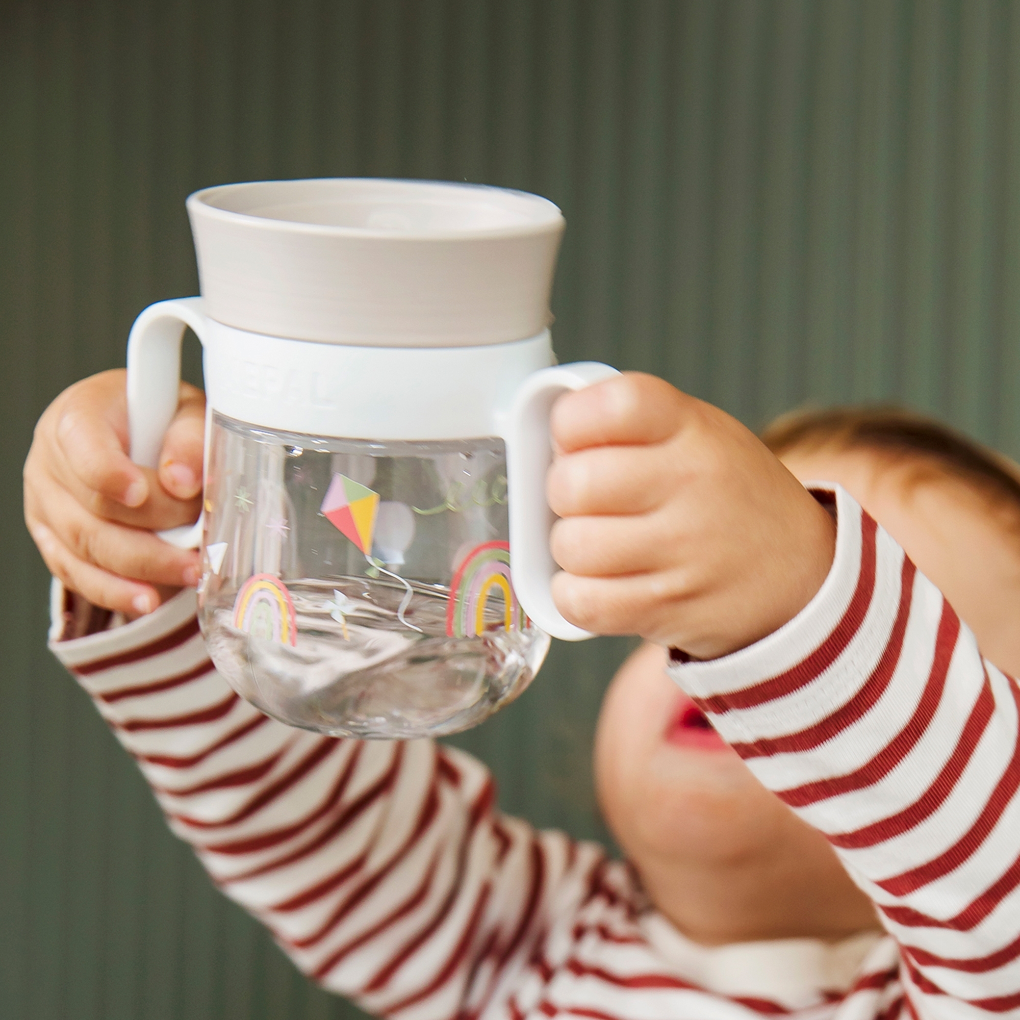 Child drinking with Mepal Mio 360° trainer cup