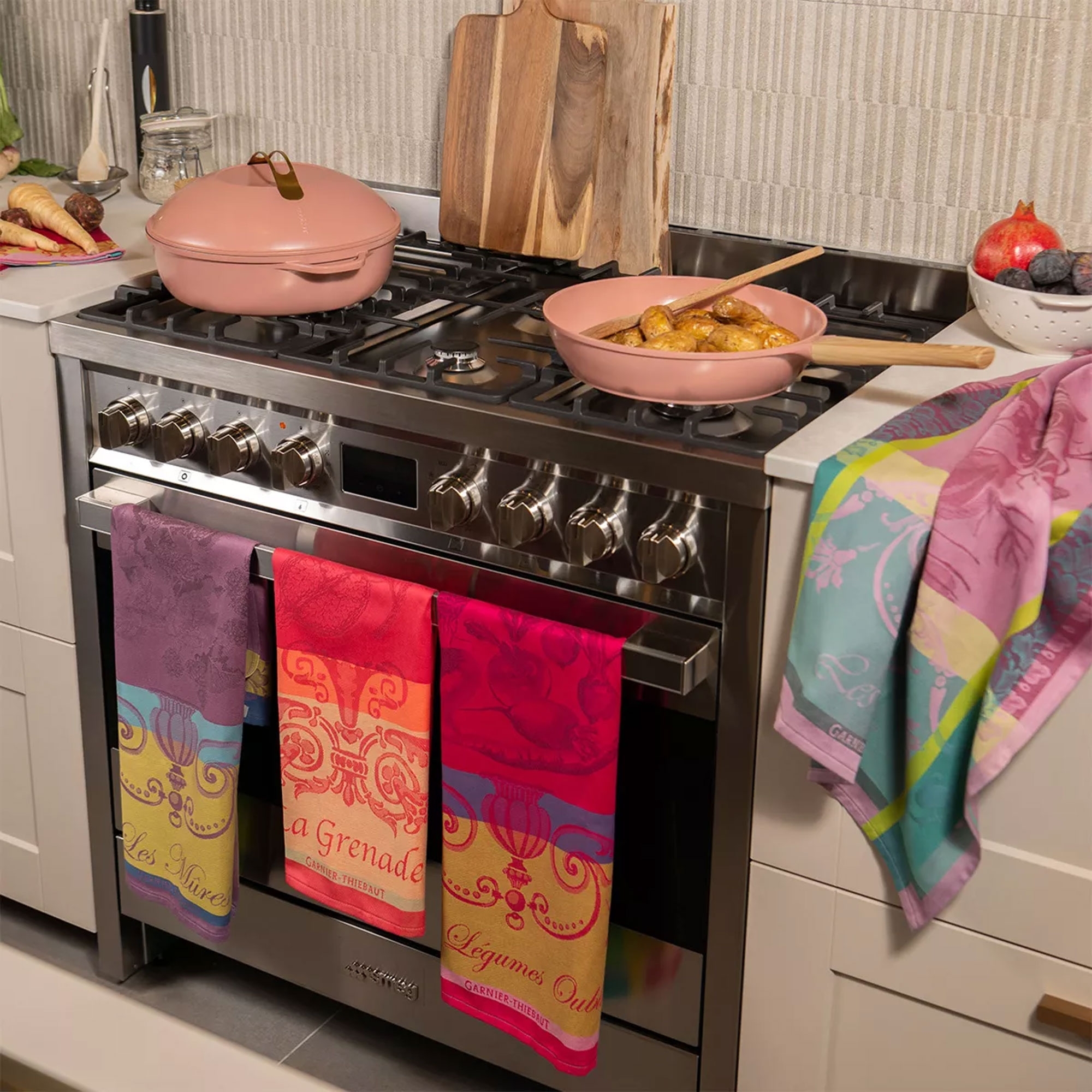 Vibrant kitchen towels on modern gas cooker