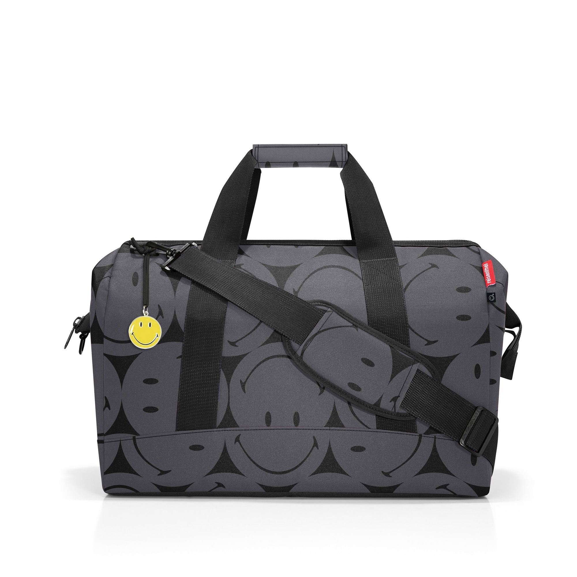 Travel bag with black smiley patterns and shoulder strap