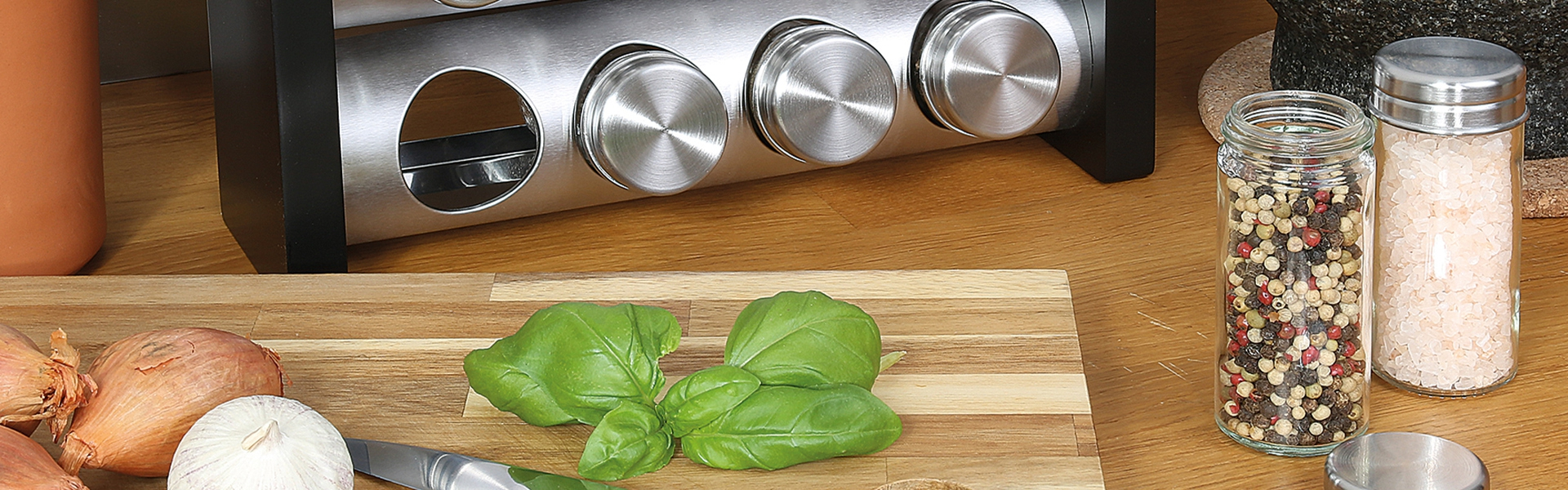 Stainless steel spice rack with jars, board, herbs
