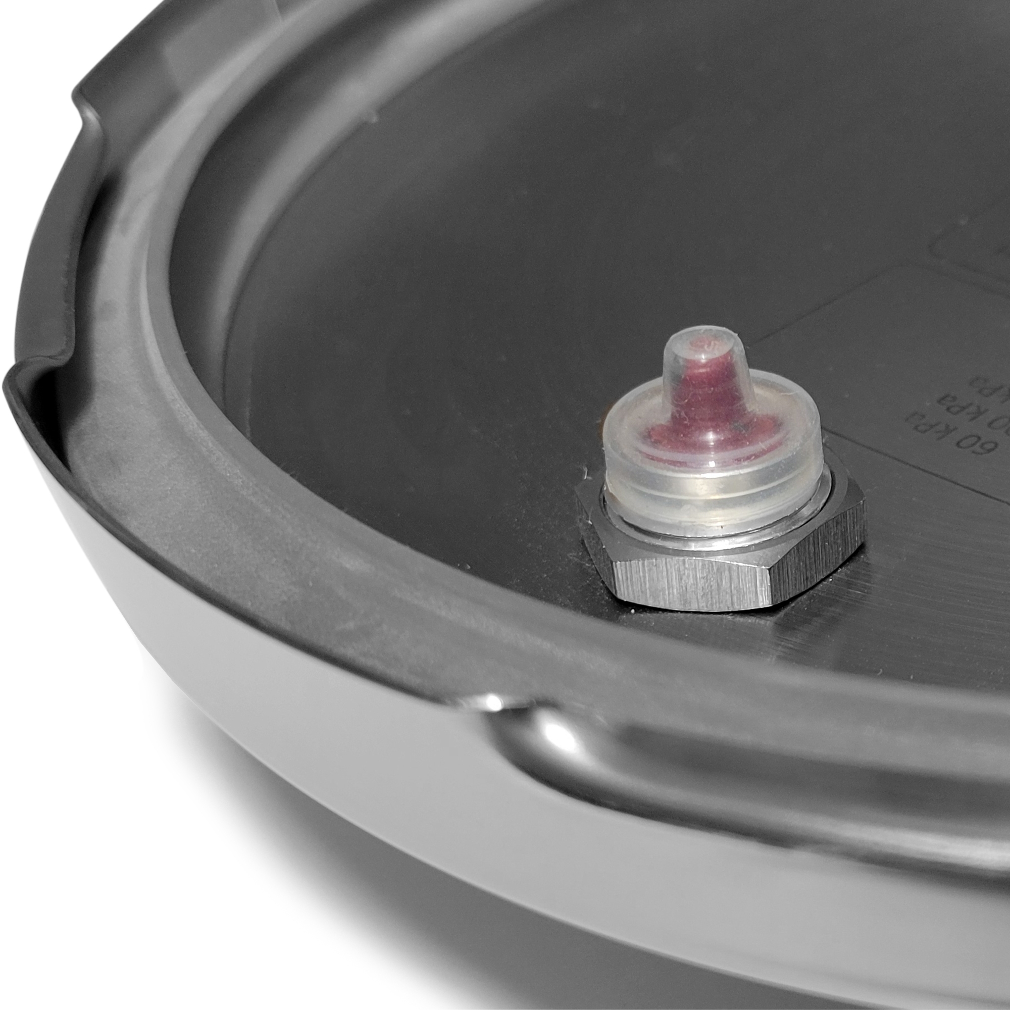 Close-up safety valve on pressure cooker lid
