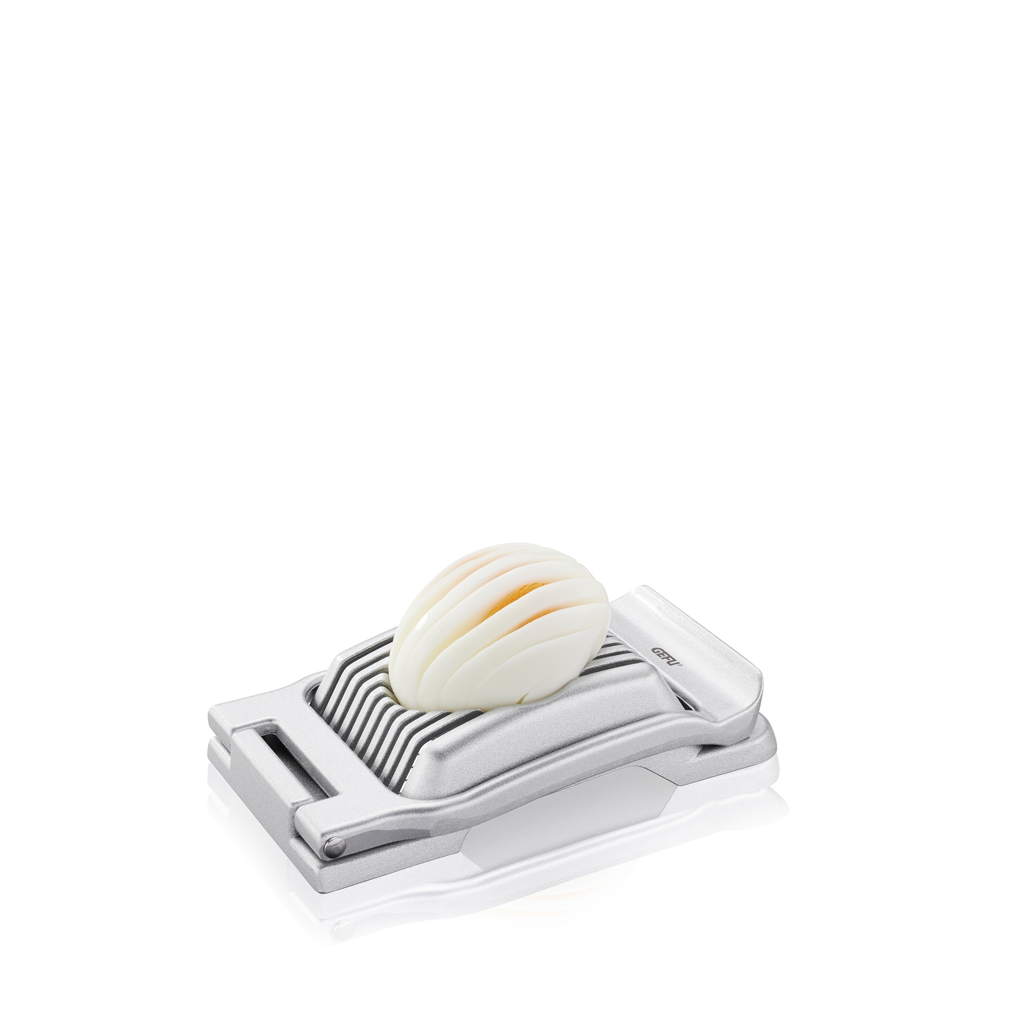 Metal egg slicer with sliced egg